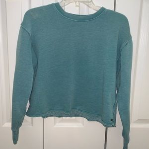 teal long sleeved cropped crew neck